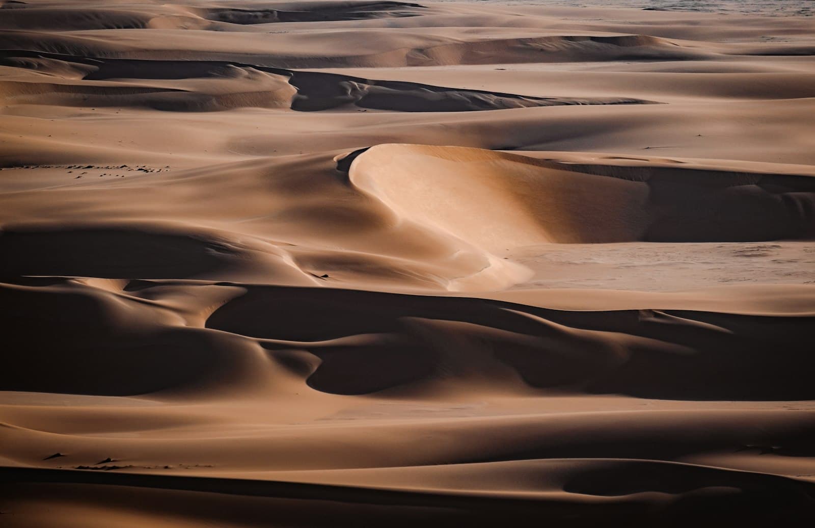 Aerial view of open desert land on the southern edge of Dubai